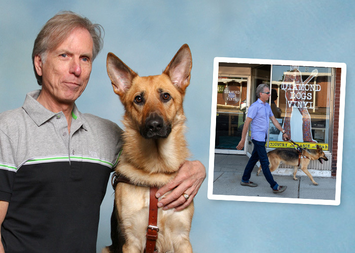 Graduate Marlin in his official portrait with his Seeing Eye dog Champ, a German shepherd with large ears. Marlin has his arm around Champ, and Champ is looking straight at the camera with a serious expression on his face. Marlin and Champ are also shown in a separate photo walking on a sidewalk in front of a record store.